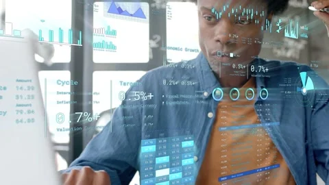 Man leaning forward inspecting display activating holograms over laptop while Stock Footage 333789826