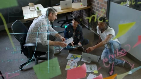 Man leaning forward presenting printout, design team rearranging mockups, 動画素材 333106038