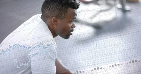Man leaning forward, responding to appearing data grid and blue chart across Stock Footage 334031252