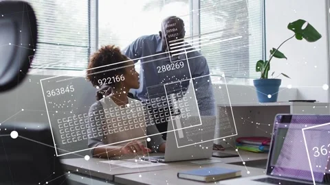 Man leaning, gesturing causing woman typing notes HUD codes animating over Stock Footage 331270198