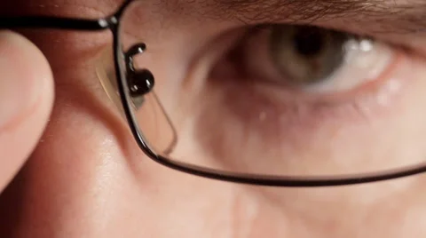Man leaning in to look into camera with glasses Stock Footage 33896233
