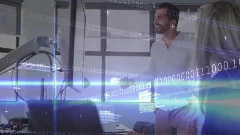 Man leaning over screen starting tech briefing pointing at code then cheering Stock Footage 328360832