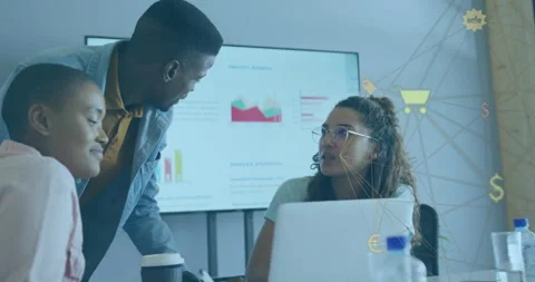 Man leaning over table pointing at graphs on display guiding business team Stock Footage 311963103