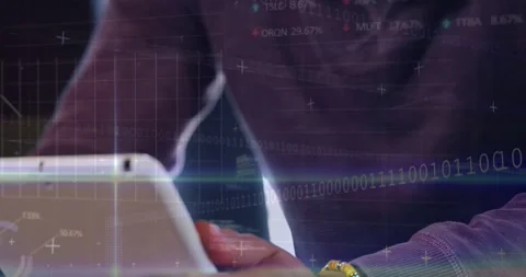 Man leaning over tablet, rotating tablet and tapping thumbs, causing tech Stock Footage 331169371