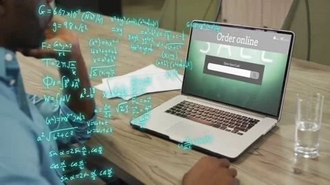 Man leaning typing area code on laptop as teal formulas building causing tech Stock Footage 333145224