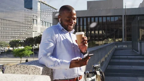 Man leaning on urban walkway code overlay fading revealing business content Stock Footage 332522928