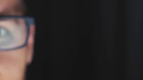 Man leans over to his computer screen and begins to code - Image is 動画素材 124733065