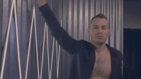 Man leans on the wall Stock Footage 105566277