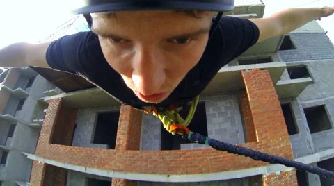 Man leaps forward, arms outstretched Stock Footage 48363600