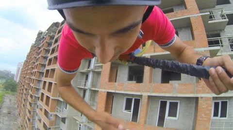 Man leaps forward, clenching his hand in the rope Stock Footage 48361668