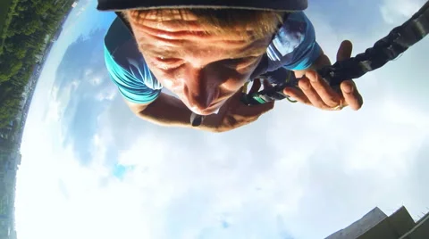 Man leaps forward, holding the rope Stock Footage 48365407