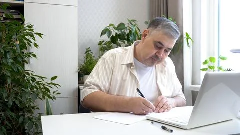 Man Learning Online with Computer Stock Photos