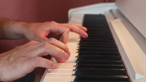 Man learning to play the piano. Stock Footage 244877917