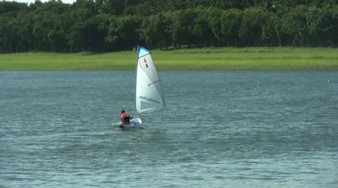 Man Learning To Use Small Sailboat 스톡 동영상 8778596