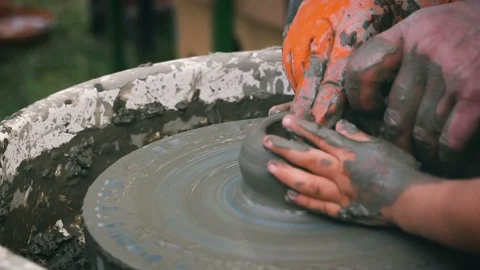 Man learning young boy the pottery craft Stock Footage 96160864