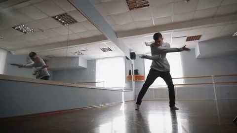 Man learns to dance. Dancer makes a jump in dance. Sensual dance of a lone man Stock Footage 70386489