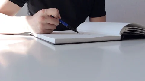 Man learns to draw with a pencil Stock Footage 89094374