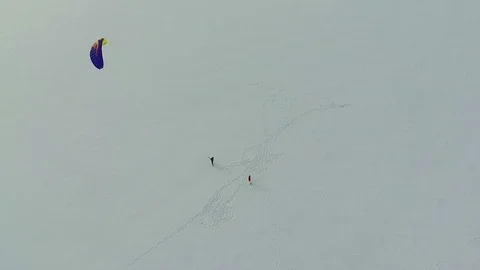 Man learns how to control the kite. aerial view backward Stock Footage 87299710