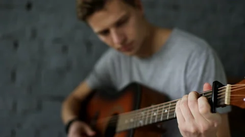 Man learns to play the guitar Stock Footage 68847626