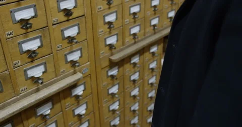 Man in leather gloves in file cabinet Video stock 86512482