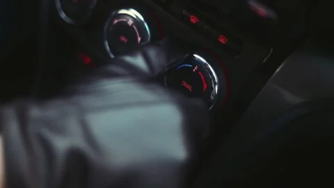 A man in leather gloves regulates the temperature in the car Stock Footage 170555292