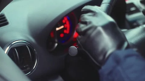 A man in leather gloves starts the engine Stock Footage 170555223
