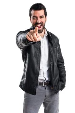 Man with leather jacket pointing to the front Stock Photos