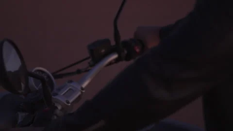 Man in a leather jacket riding a motorcycle Stock Footage 264133350