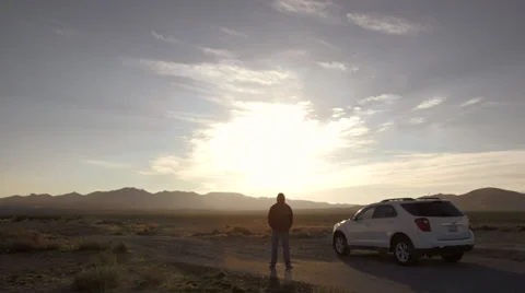 Man Leaves His Broken Down Car To Walk Into The Desert Video stock 36094819