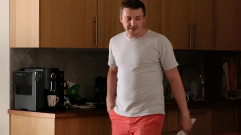 Man leaves the kitchen alone Stock Footage 134782392