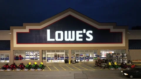 Man leaving Lowes Store in USA at night. Driving car on street. Parking lawn Stock Footage 294513003