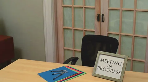 Man leaving meeting in progress 1 Stock Footage 32720158