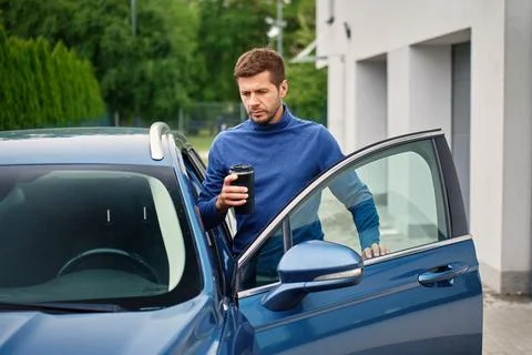 Man Leaving for Work, Get in Car with Coffee Stock Photos