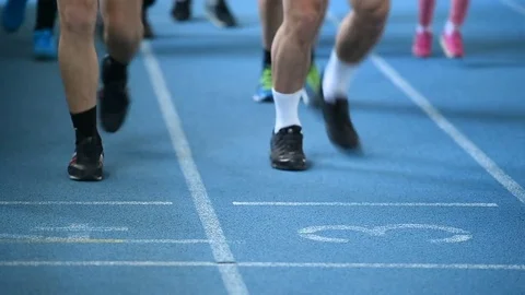 Man with leg prosthetics running on the track and field sprint court Stock Footage 72818756