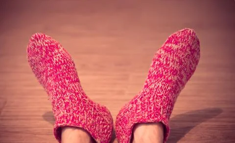Man legs in red wool socks male knitted clothes winter handmade accessories h Stock Photos