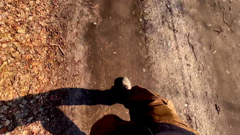 Man legs walking on sandy road. POV 4k video Stock Footage 171994280