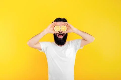 Man with lemon slices Stock Photos