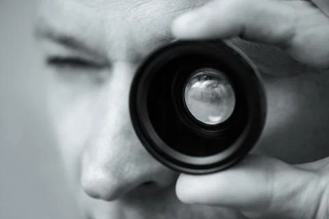 The man with a lens. Stock Photos
