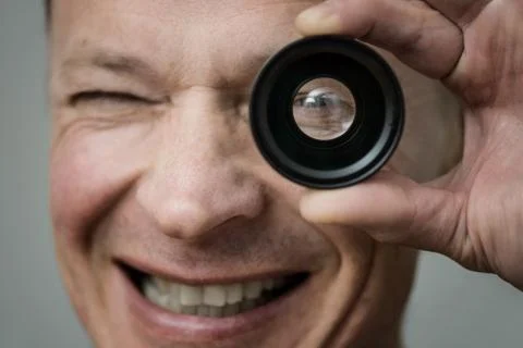 The man with a lens. Stock Photos