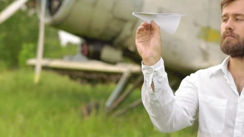 Man lets paper airplanes Stock Footage 91611484