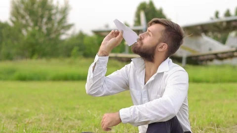 Man lets paper airplanes Stock Footage 91611771