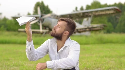 Man lets paper airplanes Stock-Footage 92465376