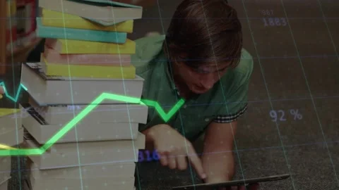 Man in library aisle tapping tablet, initiating green yellow chart overlay for Stock Footage 321070510