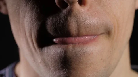 A man licks dry lips Stock Footage 129523004