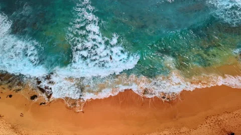 Man lies on the surfboard and rows ahead.  Video stock 307859189