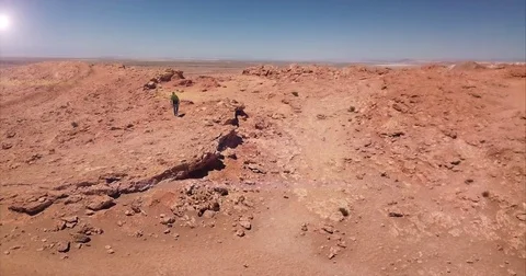 Man Lifting backpack in panoramic cliff Stock Footage 84672579