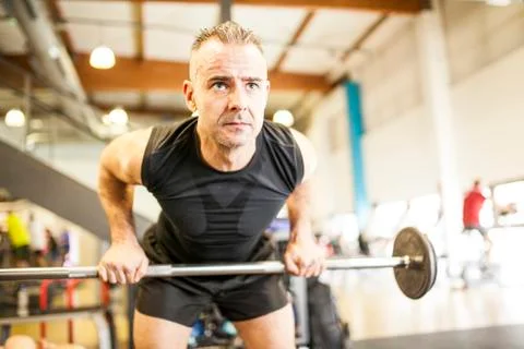Man lifting bar Stock Photos