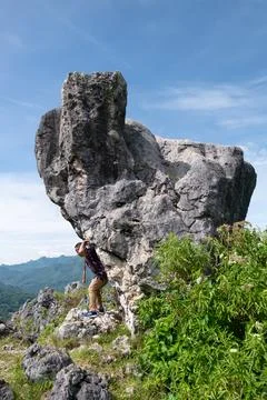 Man lifting a boulder Stock Photos