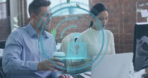 Man lifting coffee mug while woman typing on laptop initiating cyber security Stock Footage 318239733
