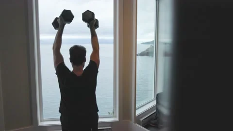 Man lifting dumbbells at the gym, working out, incline press, arm curls 動画素材 230198091